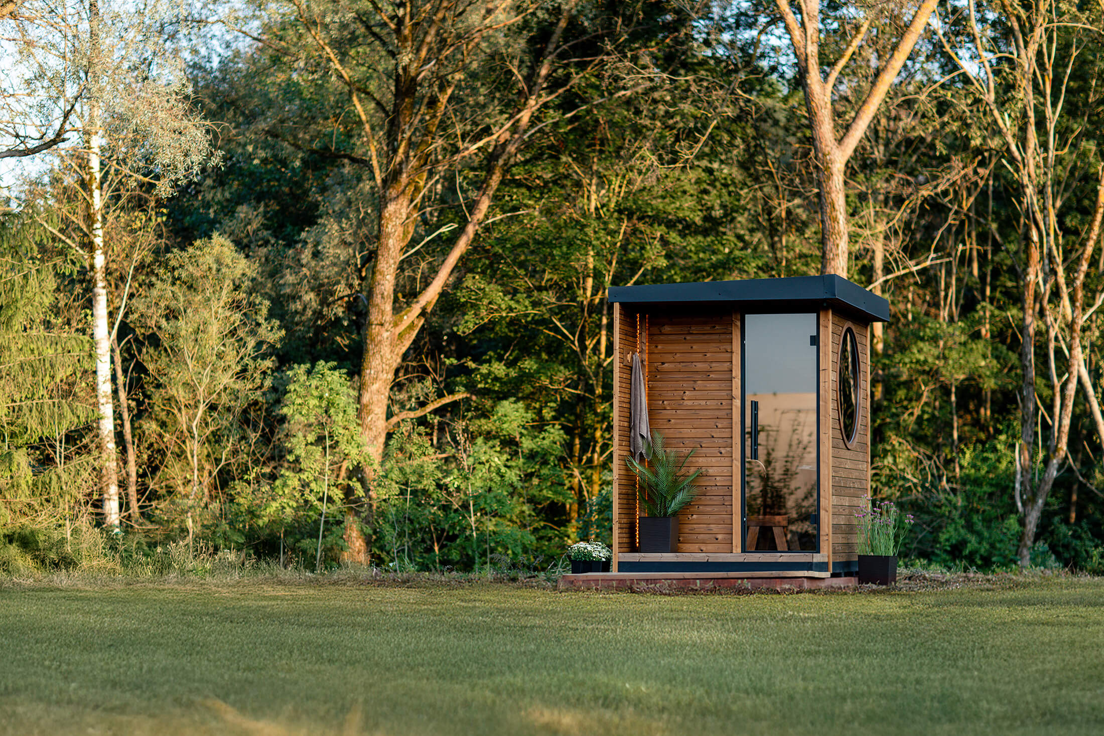 Auroom Kaia garden sauna beside a house
