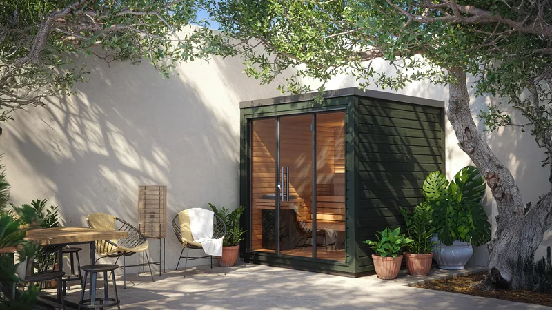 Green Auroom Mira L outdoor sauna in a sheltered courtyard